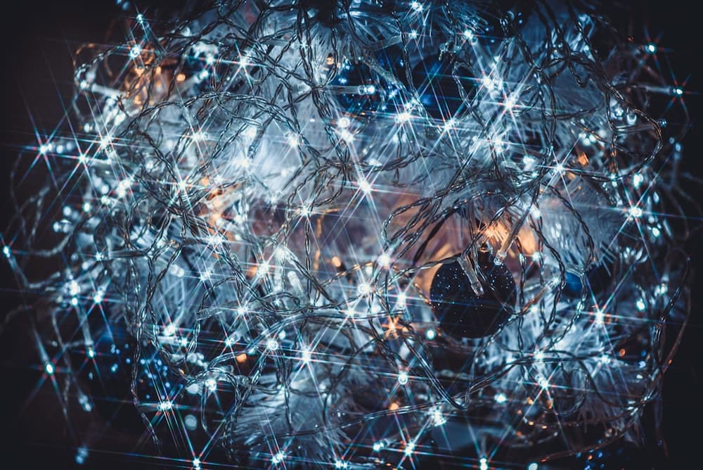 An abstract sphere of interconnected blue nodes and light filaments.